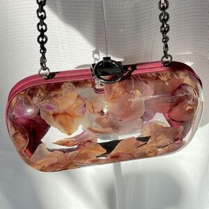 Reece Hudson clear clutch bag with rose petals